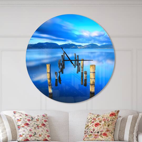 Designart 'Wooden Pier Remains In Blue Sea Modern Wall Clock